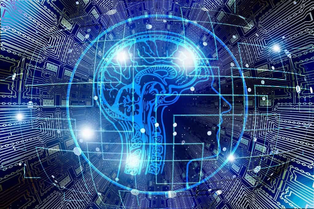 a blue brain with a circuit board pattern, surrounded by a network of computer chips and wires. The brain is prominently displayed in the center of the image, while the circuit board pattern and computer chips create a visually appealing and futuristic design. This image could be used to represent the connection between the human brain and technology, highlighting the advancements in artificial intelligence and the potential for integrating human intelligence with computer systems.